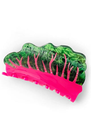 Hair clip with green chard and pink base on a white background