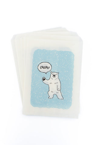 Bags with a polar bear design and 'Cheers!' text on a white background