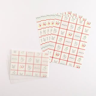 Letter set pages with cartoon chinchilla next to matching envelopes