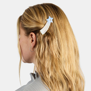 person wearing shooting star shaped hairclip