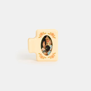 Small rectangular hairclip with a photo frame and floral design on a white background