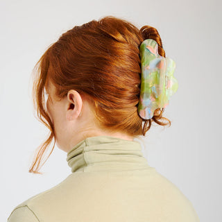 Pastel jelly claw clip worn in red hair, curved translucent claws
