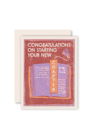 Greeting card with text 'Congratulations on starting your new chapter' and an illustration of a book.