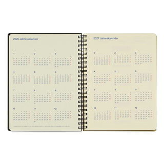 Open spiral-bound calendar showing pages for 2026 and 2027 on a white background.