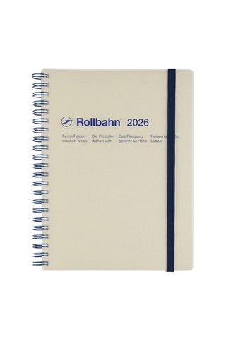 Beige notebook with spiral binding and 'Rollbahn 2026' branding on a white background