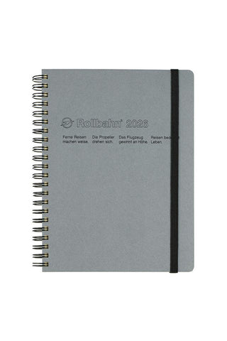 Gray notebook with black band on a white background