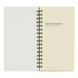 Notebook with spiral binding on a white background