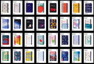 Assorted colorful notebooks with different covered numbered 033 - 064
