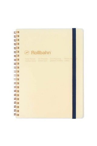 gold spiral notebook with dark blue band, clear cover, and yellow pages