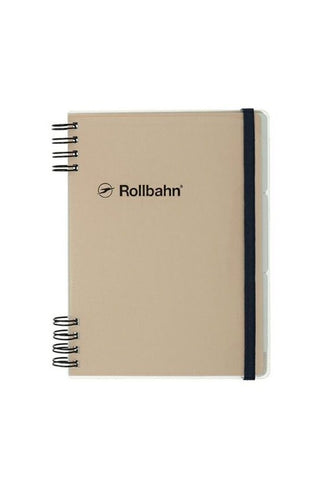 Beige notebook with black spiral binding and 'Rollbahn' logo on a white background