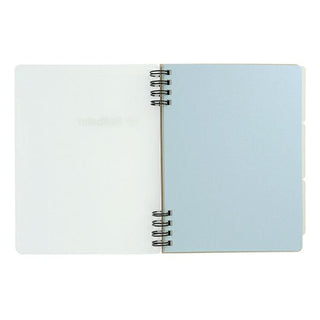 Open spiral-bound notebook with light blue pages on a white background