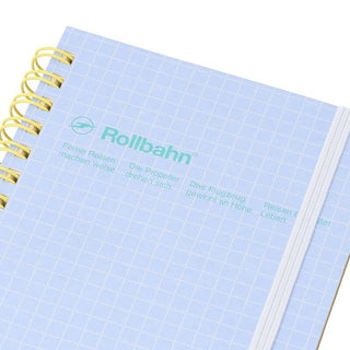 Notebook with light blue grid cover and spiral binding, featuring 'Rollbahn' branding.