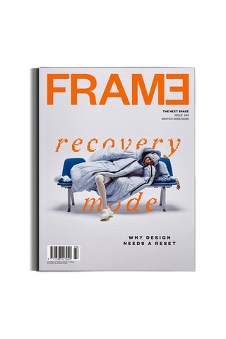 Magazine cover with 'FRAME' branding and a person on a bench on a white background