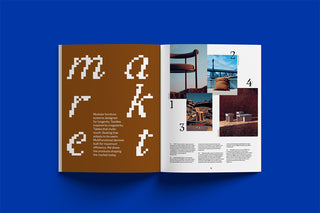 Open book with interior design layout on a blue background