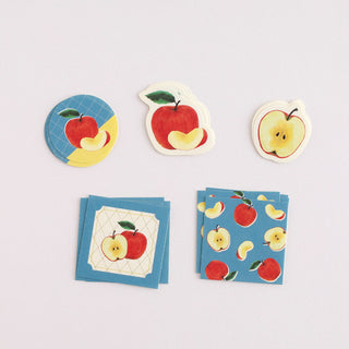 Set of apple-themed stickers on a light gray background