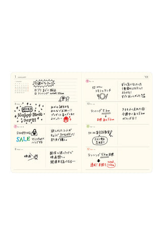 cream-colored planner page with a weekly block format with handwritten Japanese notes, stickers, and small illustrations
