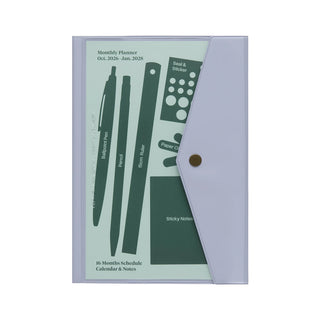 A monthly planner with a light purpleish/grayish cover with a button case that can hold small items inside the cover.
