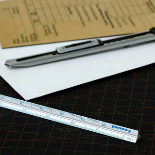 Light gray metric drafting scale with blue and black measurement markings