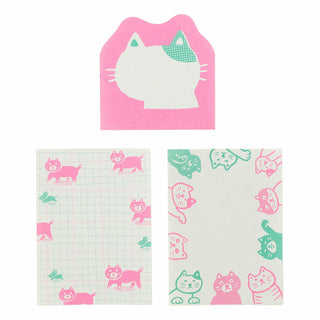 Set of three cat-themed memo pad sheets with pink and green designs on a white background
