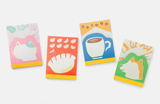 Four colorful notepads with different designs on a white background