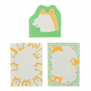 3 different memo pad sheets with dog illustrations on a white background