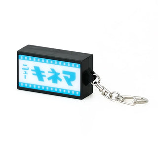 A black rectangular keychain light featuring a glowing blue and white screen with Japanese text