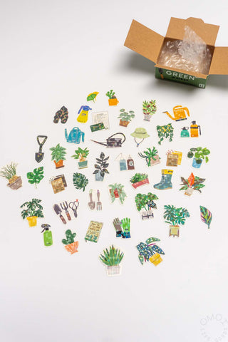 Collection of small gardening-themed stickers on a white background with an open box labeled 'Green'.