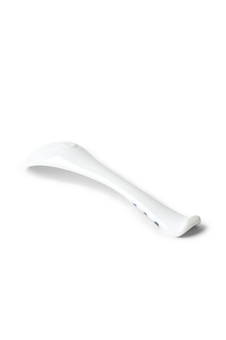 White spoon on a white background