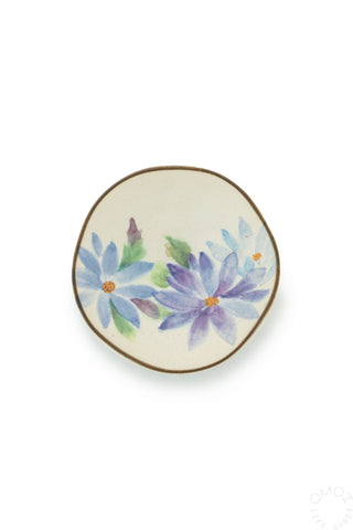 Decorative plate with floral design on a white background