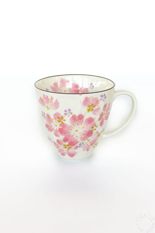 Cherry blossom-patterned mug on a white background