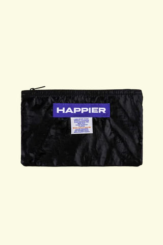 Black pouch with 'Happier' branding on a beige background