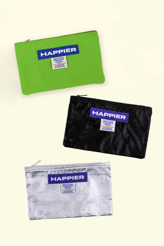 Three pouches in green, black, and silver with 'Happier' branding on a white background.