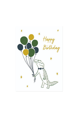 Birthday card with a crocodile holding balloons and 'Happy Birthday' text on a white background.