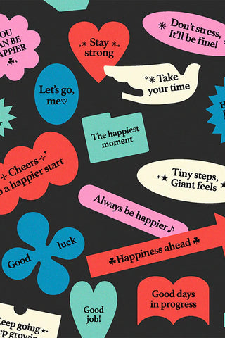 Colorful stickers with encouraging text scattered on a dark background
