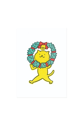 Yellow cat holding a wreath on a white background