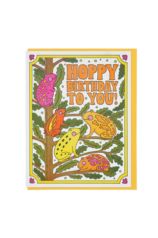 Colorful birthday card with cartoon frogs and the text 'Happy Birthday to You!' on a white background.