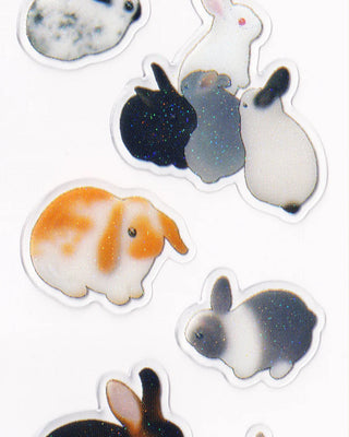 Set of rabbit stickers with different colors and patterns on a white background