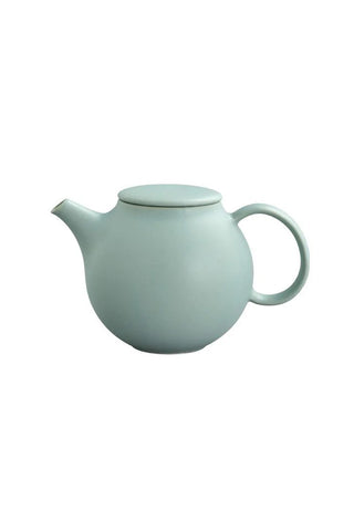 Light blue ceramic teapot on a white background
