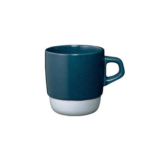 Blue mug with light colored base on a white background