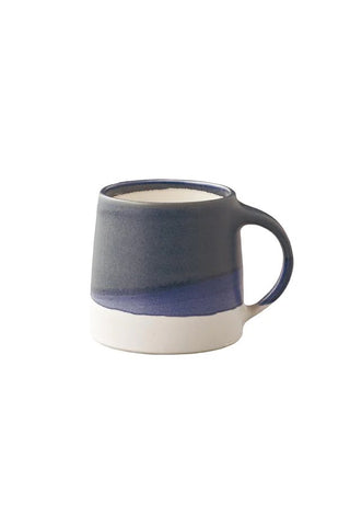 Blue and white ceramic mug on a white background