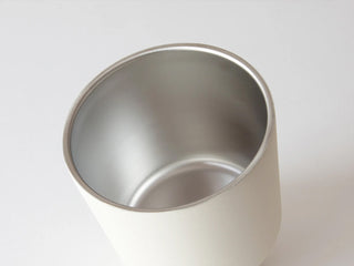 Metallic cup on a white background