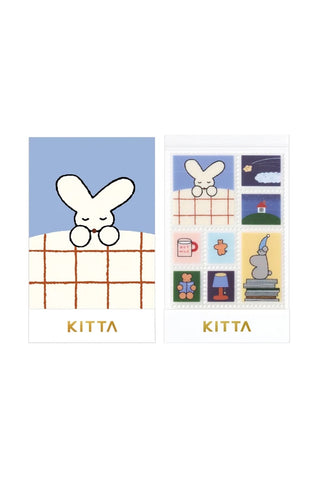 KITTA washi tape shown next to its packaging on a white background. The stickers show a collage of small illustrated scenes of night time routines and animals