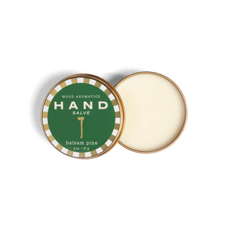 Hand salve in a tin with balsam pine scent on a white background