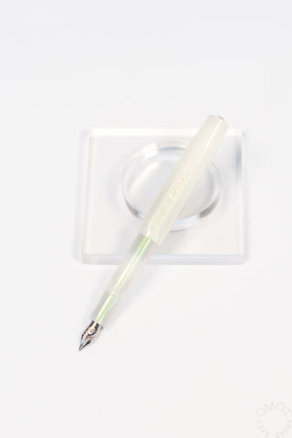 Kaweco lunar light green fountain pen on a clear stand