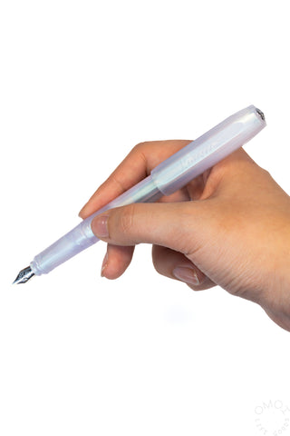 Hand holding Kaweco perkeo fountain pen on a white background