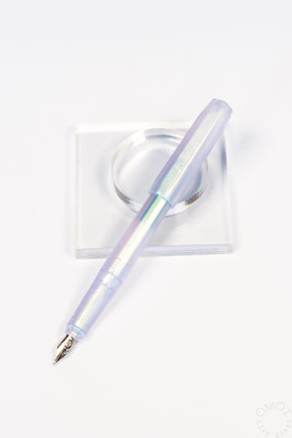Iridescent pearl fountain pen with silver nib in a clear display box