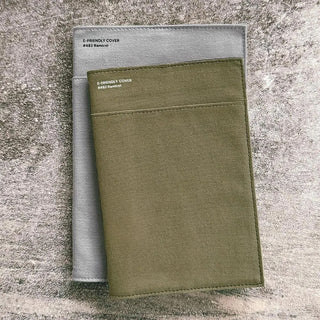 Green and gray fabric cover on a gray textured background