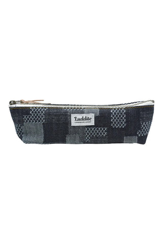 Navy patchwork LUDDITE canvas boat pen case with gold zipper and brand label.