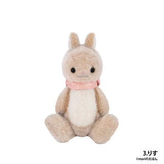 Plush toy resembling a rabbit with a pink bow on a white background
