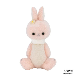 Plush toy rabbit with a white bow on a white background
